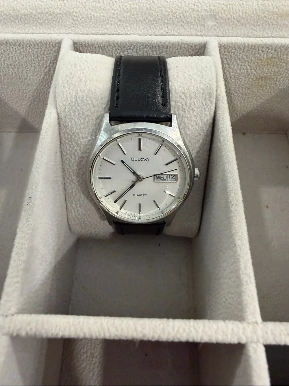 Bulova Silver Case Watch with White Dial and Black Leather Strap